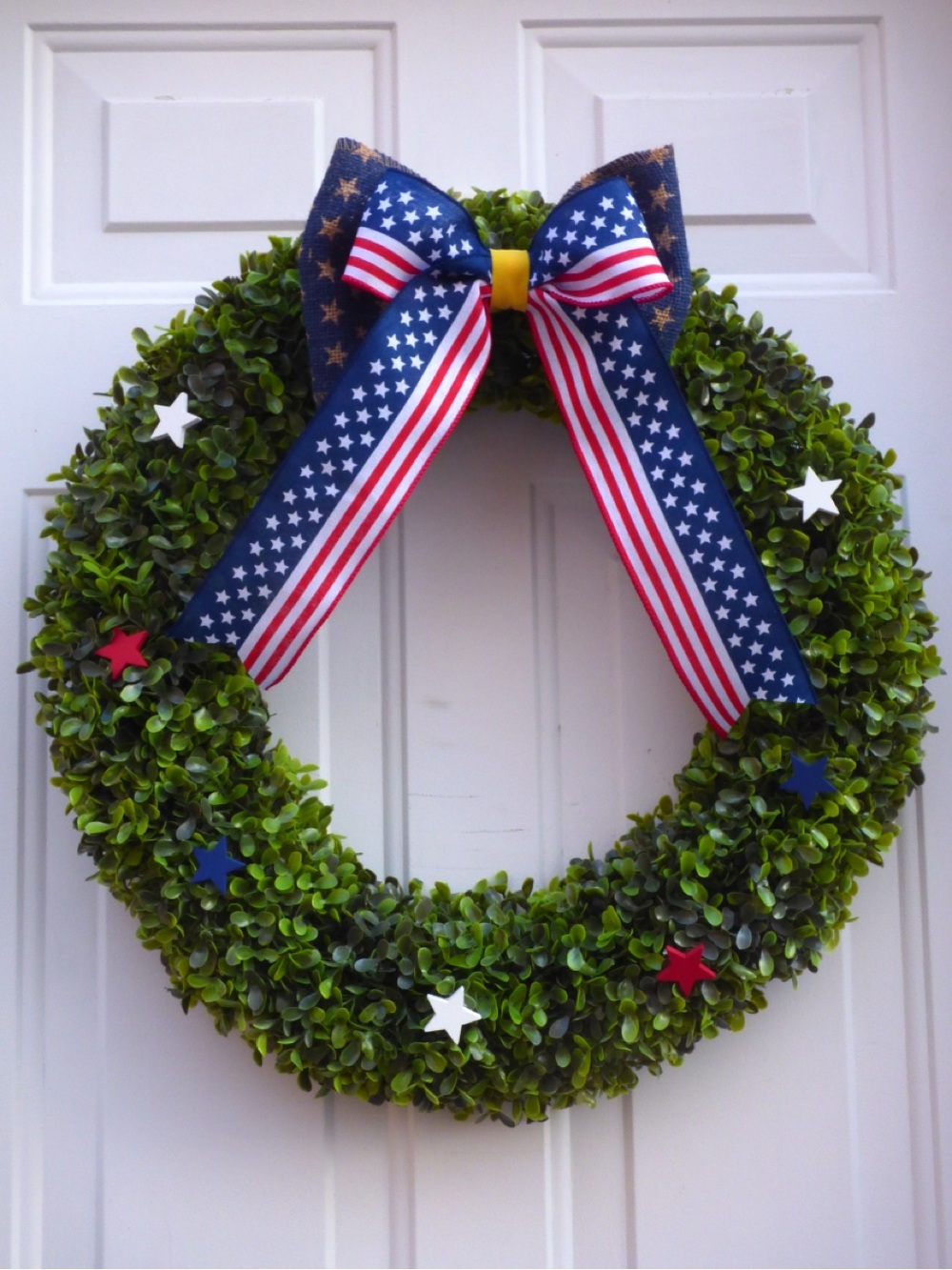 Patriotic Green Boxwood Wreath with Red White Blue Stars and Bow